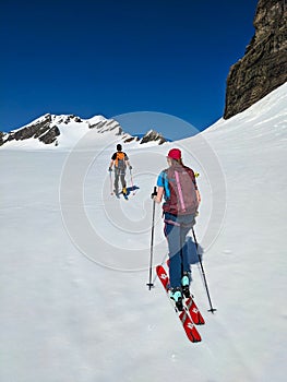 Backcountry Ski tour on the Clariden in Glarus Uri. Skitour over the glacier in the Swiss Alps. Skimo mountaineering.