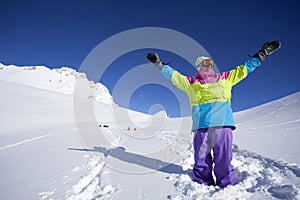 Backcountry snowboarder hiking to summit photo