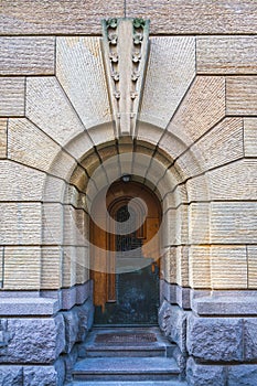 The Backdoor of a huge castle closed with a solid strong wooden door