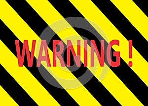 A backdrop of bright yellow and black stripes sign with the word warning