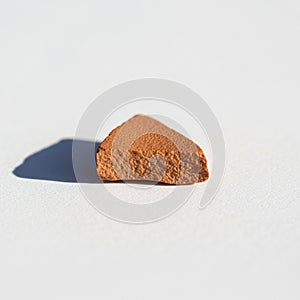 Backdrop casting a distinct shadow indicating a light source positioned