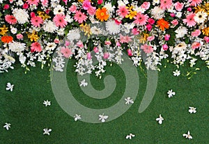 Backdrop flowers arrangement on turf for wedding ceremony