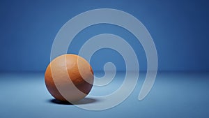 The backdrop is a gradient of blue creating a minimalist and serene setting