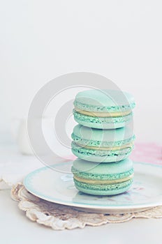 Backdrop with mint macaroon on light background