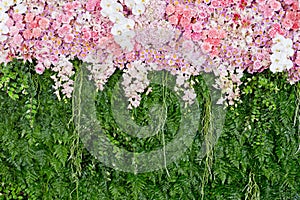 backdrop pink flowers and green leaf arrangement for wedding ceremony