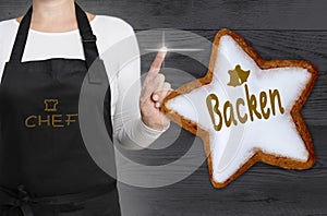 Backen (in german baking) cinnamon star is shown by chef