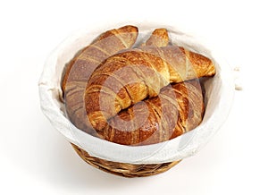 BACKET WITH CROISSANTS AGAINST WHITE BACKGROUND photo