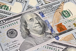 Background from 100 US dollar bills close up. Money background.