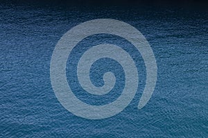 Background of abstract dark seawater in Italy. Blue color. Image for your design