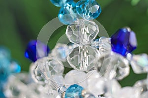 Background of abstract glittering lights. Blurred crystal beads for the background. de-focus.