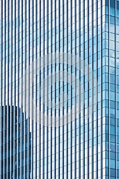 Background abstract line pattern on glass wall surface of skyscraper in perspective view