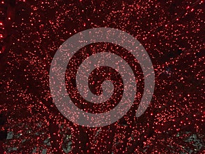 Background Abstract of red Christmas lights on tree in temple square by LDS mormon temple in Salt Lake city, Utah, USA.