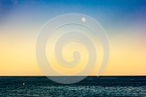 Background. abstract. seascape with colored sky and moon. ideal for wallpapers photo