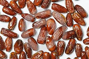 Background with Algerian dates in close-up. Wallpaper with dried fruits