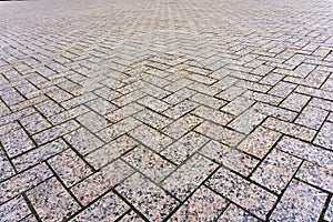 Background - area paved with granite paving tiles