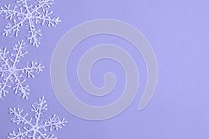 Background with artificial white snowflakes. New Year`s and Christmas. winter motives. Color of the year 2022 from pantone. Very p
