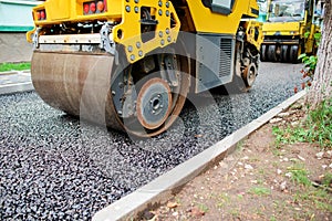 Background of asphalt roller that stack and press hot asphalt. Road repair machine