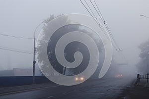 Background autumn fog on city road