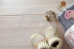 Background with baby accessories on wooden table