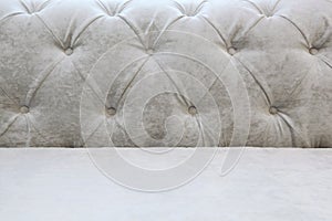 Background with a back and a seat of a light sofa - Carriage screed