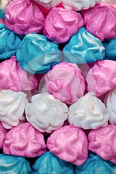 Background of baked multicolored meringue cookies