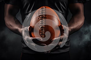 Background with a ball in hands of American football player.