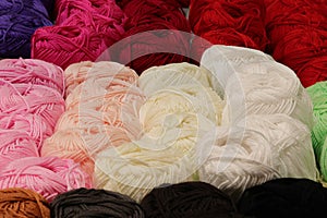 background of balls of fabric for sale in haberdashery shop