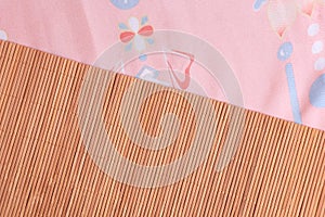 Background of bamboo mat and and pink fabric in a traditional style. Chinese Japanese background