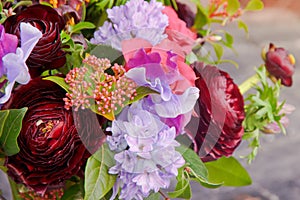 Background of beautiful different flowers and roses in the bouquet florist closeup