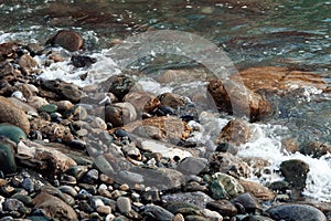 Background with beautiful wet stones and water.