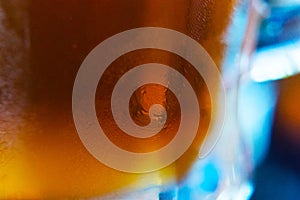 Background of beer and misted glass color close-up