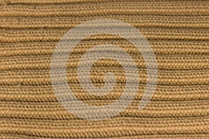 Background beige knitted from yarn warm straight bulk stripes