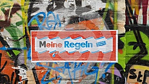 Background of Berlin street art graffiti with Meine Regeln sign painted