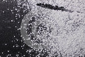 Background black white flour or powdered sugar sprinkled with black surface spears copy space