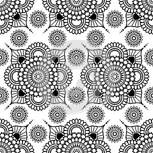 Background with black and white mehndi henna seamless floral lace buta decoration items on white background in Indian style.