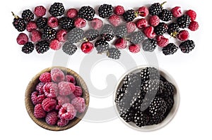 Background of blackberry and raspberry on white background. Blackberry and raspberry isolation. Top view. Black and pink berry. Im photo