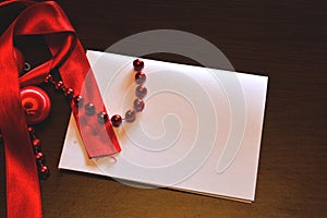 Background, blank paper and red ornaments