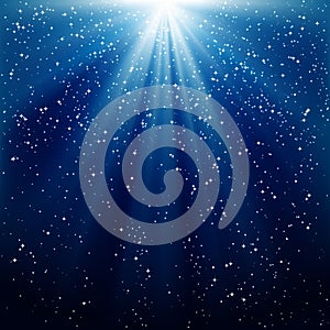 Background of blue luminous rays.