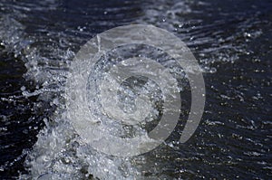 Background in blue shades, the trail on the water for a motor boa