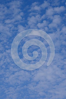 Background of blue sky with many small clouds