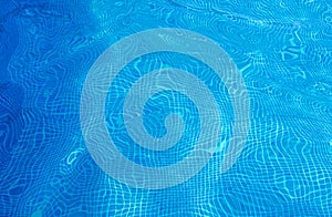 Background of a Blue Tiled Pool with Clear Cool Rippling Water