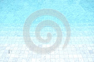 Blue tiled pool with clear cool rippling water