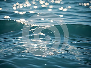 background of blue water surface with sun glare