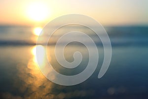 background of blurred beach and sea waves with bokeh lights