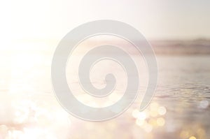 background of blurred beach and sea waves with bokeh lights