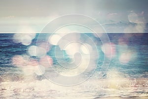 Background of blurred beach and sea waves with bokeh lights