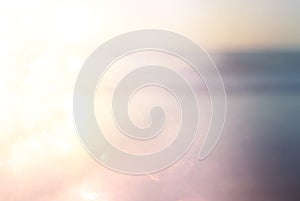 background of blurred beach and sea waves with bokeh lights, vintage filter