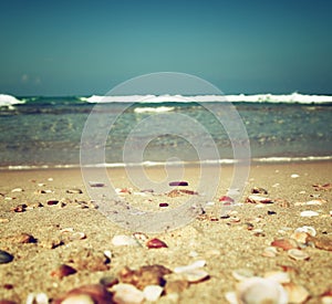 Background of blurred beach and sea waves, vintage filter.