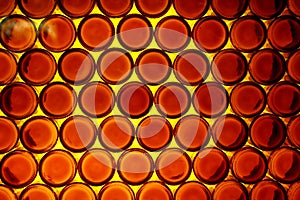 Background of bottoms of orange bottles