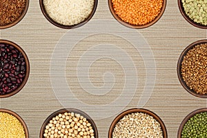 Background - bowls with various grains and beans form a frame